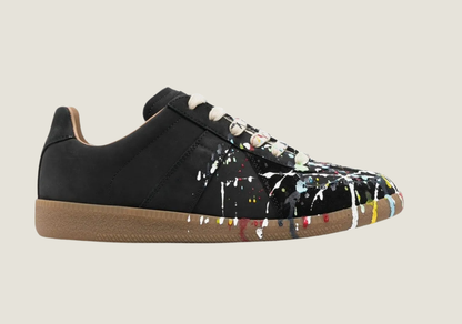 MM  nubuck leather and velour featuring a paint splatter design.