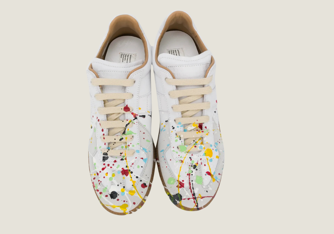 MM Dirty Wash nubuck leather and velour featuring a paint splatter design.