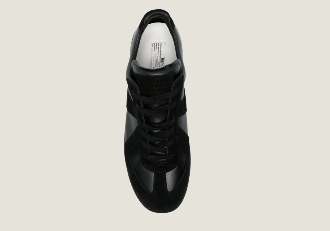 MM Black nappa leather with the iconic stitching at the back.