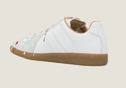 MM Dirty Wash nubuck leather and velour featuring a paint splatter design.