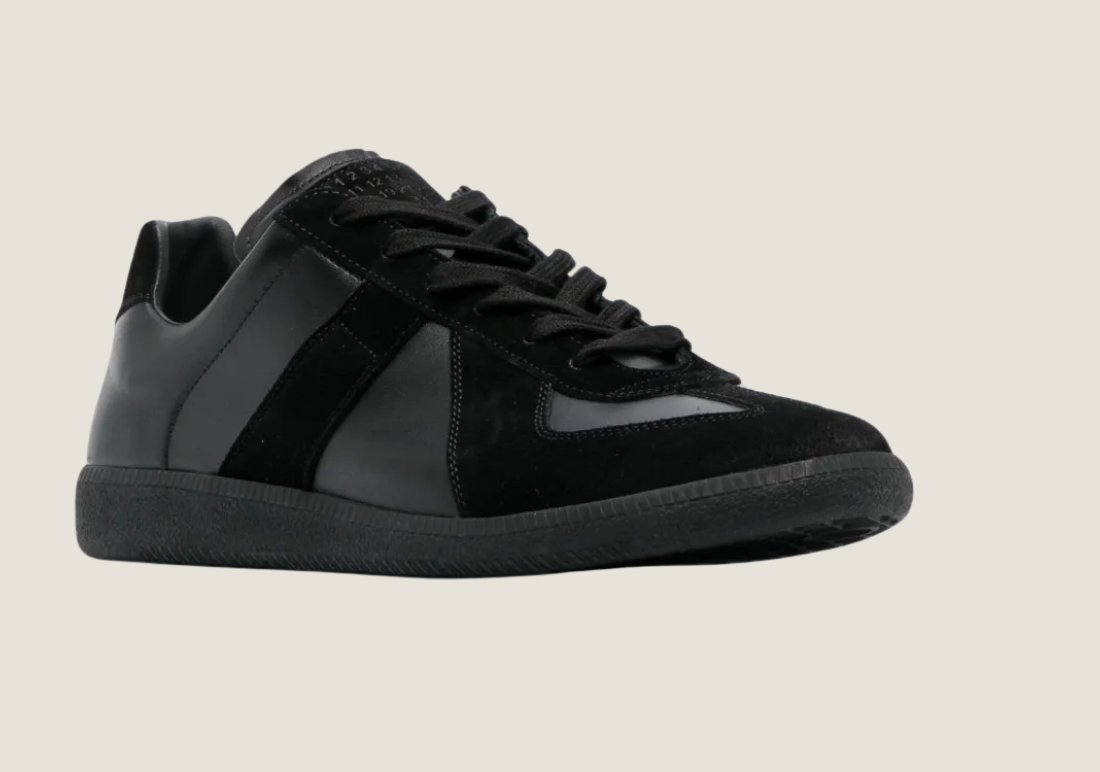 MM Black nappa leather with the iconic stitching at the back.