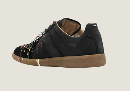 MM  nubuck leather and velour featuring a paint splatter design.