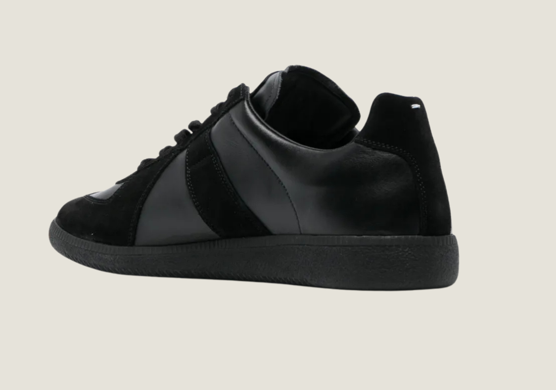 MM Black nappa leather with the iconic stitching at the back.