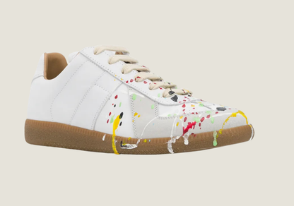 MM Dirty Wash nubuck leather and velour featuring a paint splatter design.